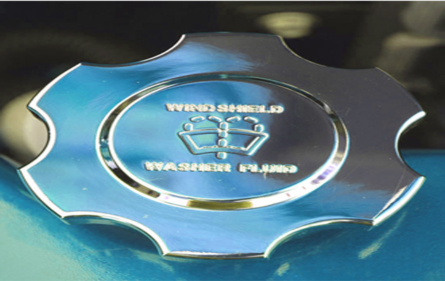 A close up of the words " wing shield washer fluid ".